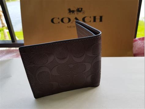 cartera coach hombre cafe.